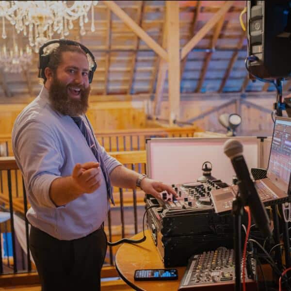 Image of a wedding DJ performing at a wedding reception.